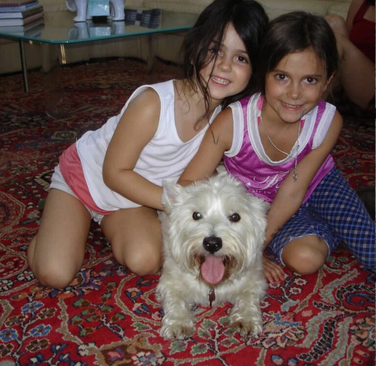 The Alvarez Family at home with their West Highland White Terrier