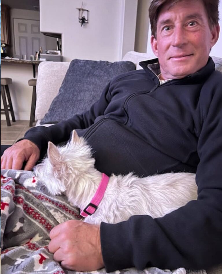 Roy Ferguson at home with their West Highland White Terrier