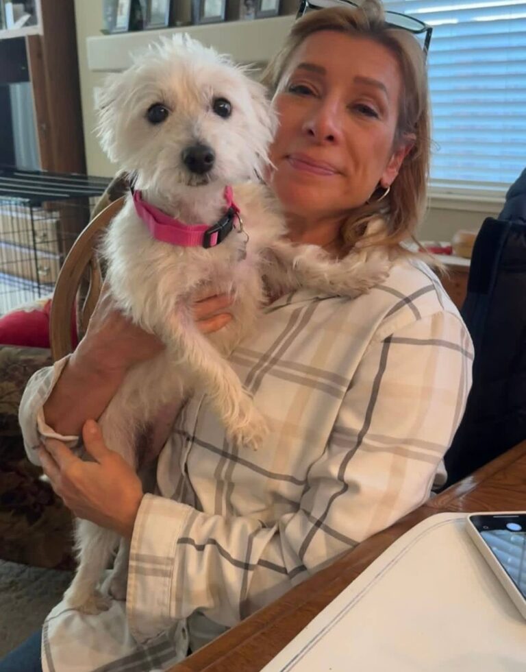 Lauren Kowalski at home with their West Highland White Terrier