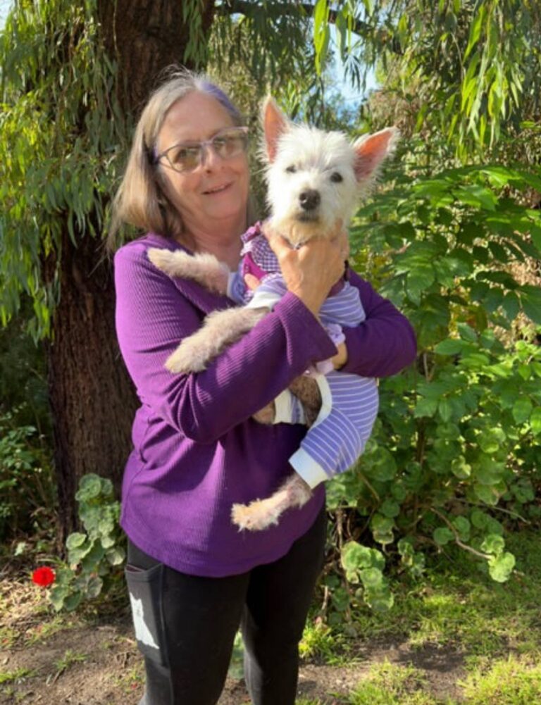 Meredith Sloane at home with their West Highland White Terrier