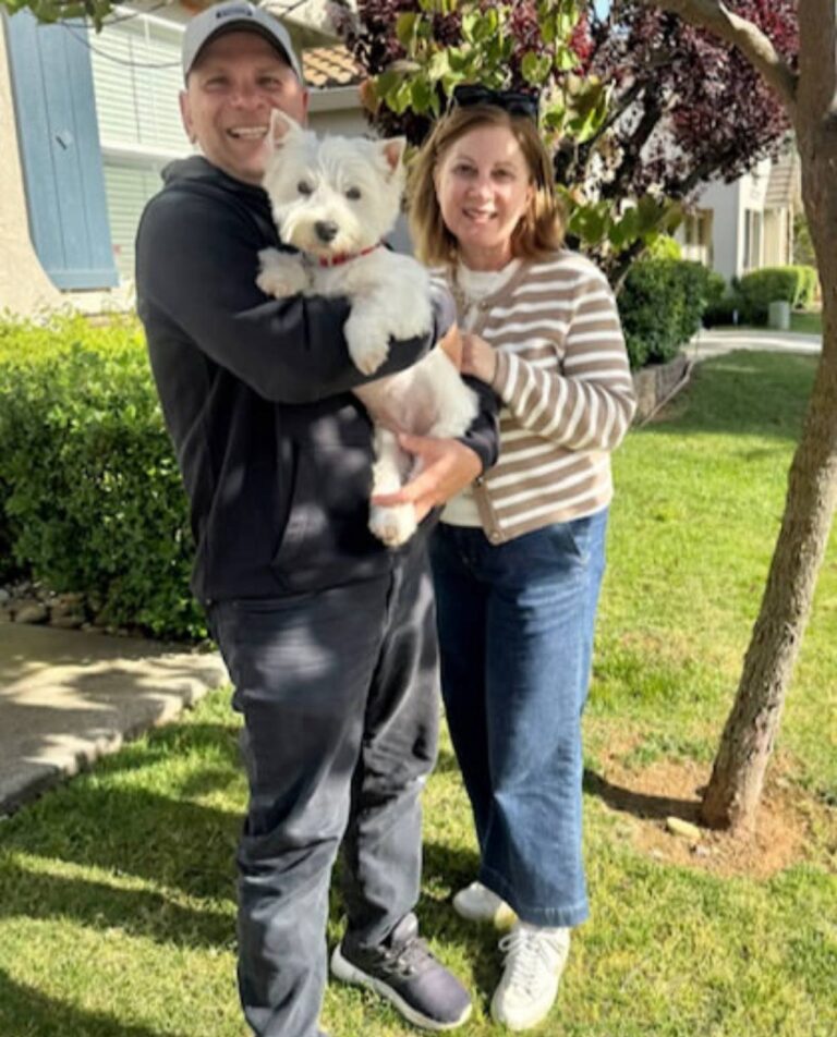 Bianca Tomlin at home with their West Highland White Terrier