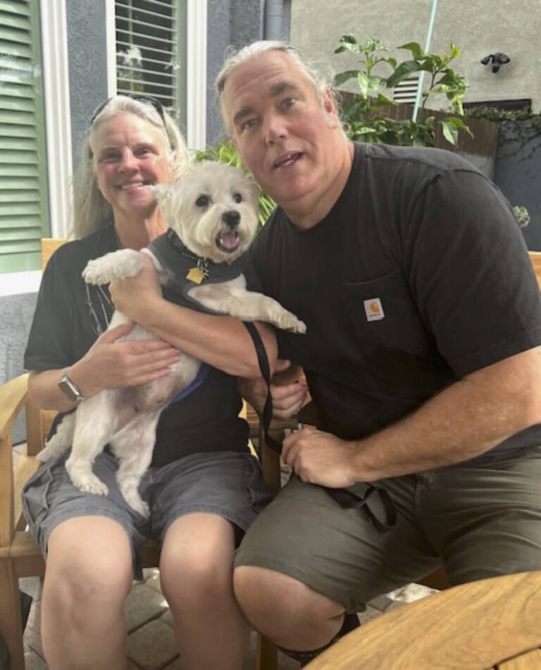 Curtis Lang at home with their West Highland White Terrier
