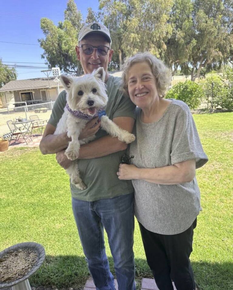 Hannah & Doug Beaumont at home with their West Highland White Terrier